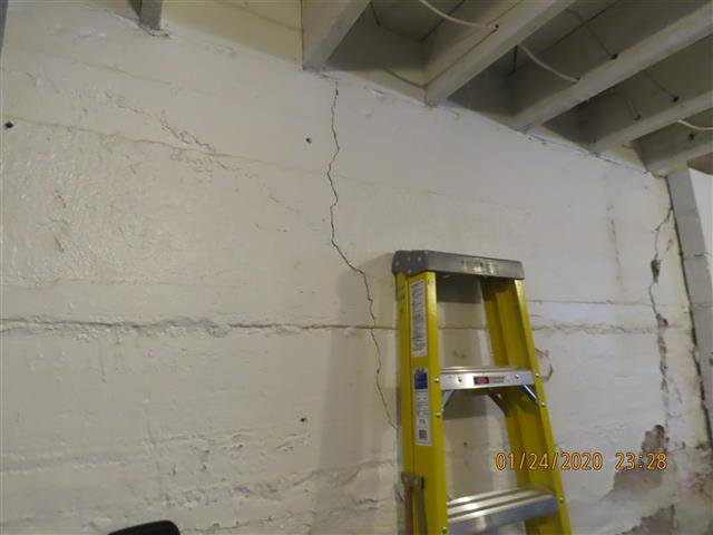 Vertical foundation crack from freeze-thaw cycle — Minnesota home inspection